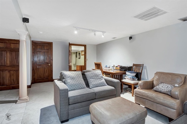 741 Longlane Road New Lenox, IL 60451 - Photo 18 of 28 a living room with furniture and a couch