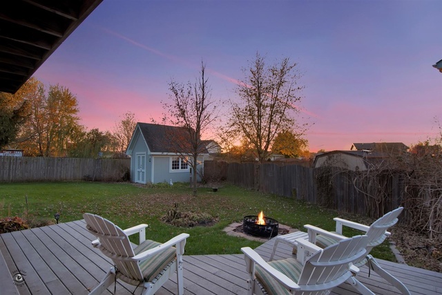 741 Longlane Road New Lenox, IL 60451 - Photo 3 of 28 a view of a chairs and table in backyard of the house