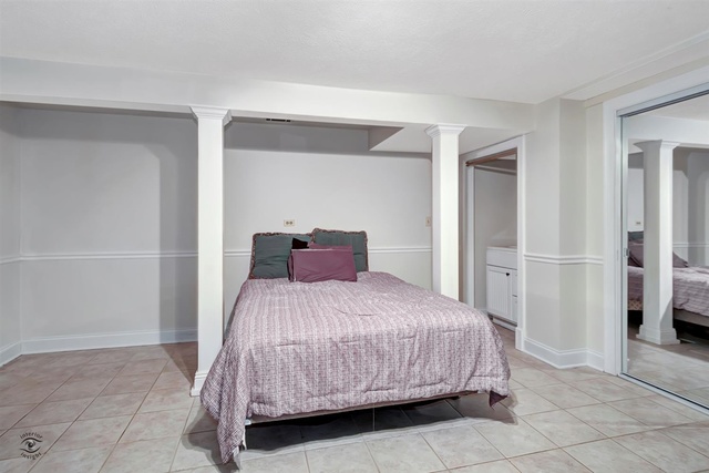 741 Longlane Road New Lenox, IL 60451 - Photo 21 of 28 a bedroom with a bed and cabinets