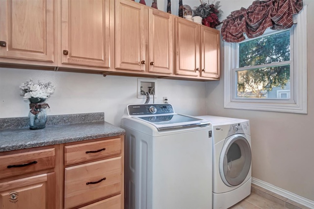 741 Longlane Road New Lenox, IL 60451 - Photo 22 of 28 a utility room with granite countertop cabinets washer and dryer