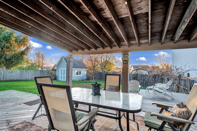741 Longlane Road New Lenox, IL 60451 - Photo 24 of 28 a view of a porch with furniture and yard