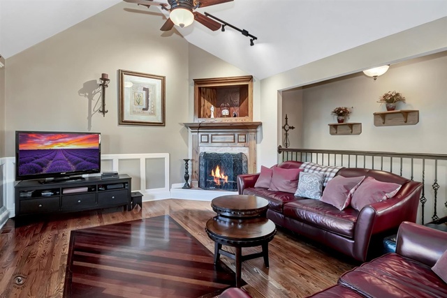 741 Longlane Road New Lenox, IL 60451 - Photo 5 of 28 a living room with furniture and a flat screen tv