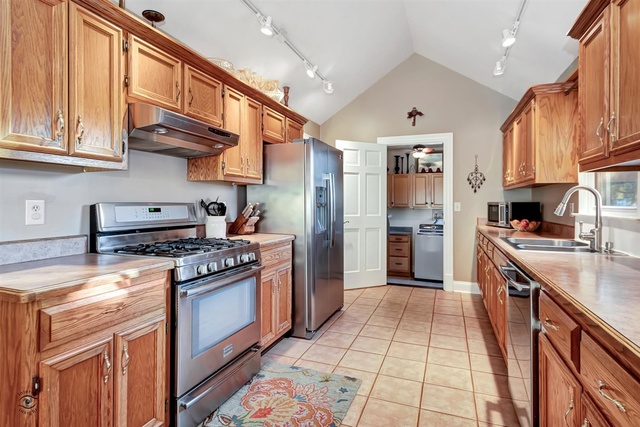 741 Longlane Road New Lenox, IL 60451 - Photo 10 of 28 a kitchen with stainless steel appliances granite countertop a stove and a refrigerator