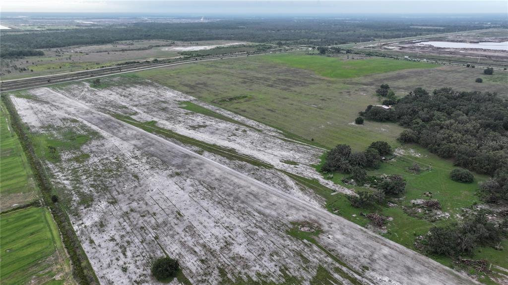 1455 South Duette Road Myakka City, FL 34251 - Photo 12 of 15 a view of a field with wooden fence
