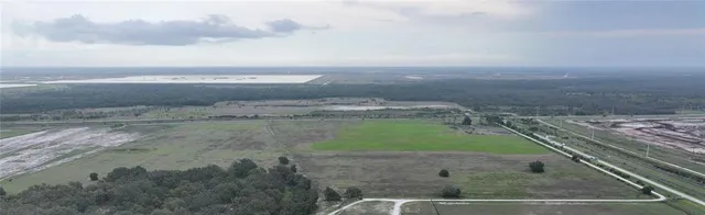 a view of a lake with a big yard