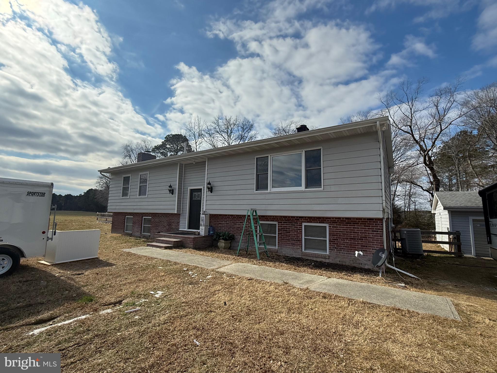 13830 Cooley Road Princess Anne, MD 21853 - Photo 2 of 7 a view of a house with a yard and garage
