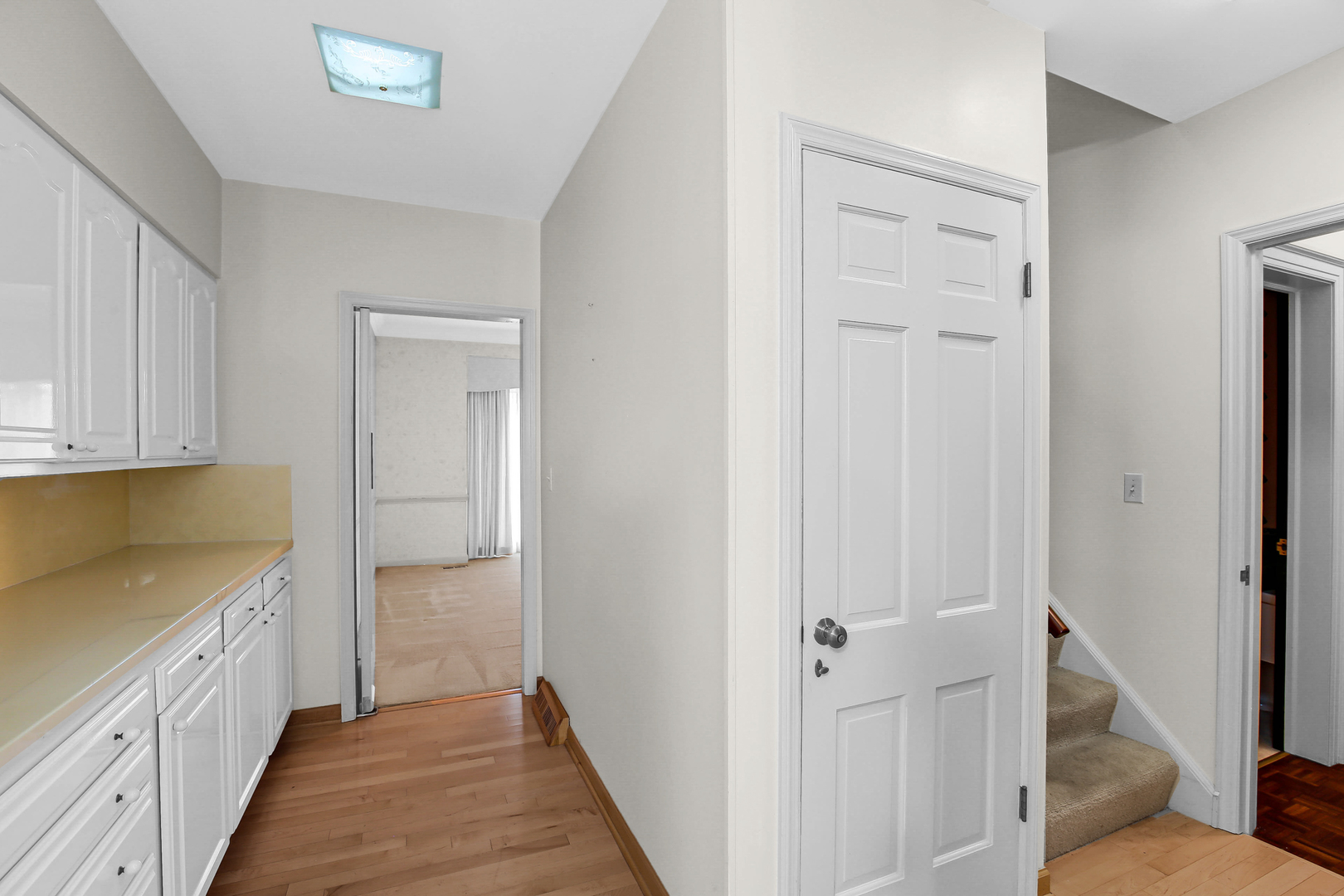 9S174 Drew Avenue Burr Ridge, IL 60527 - Photo 18 of 49 a view of a kitchen from the hallway