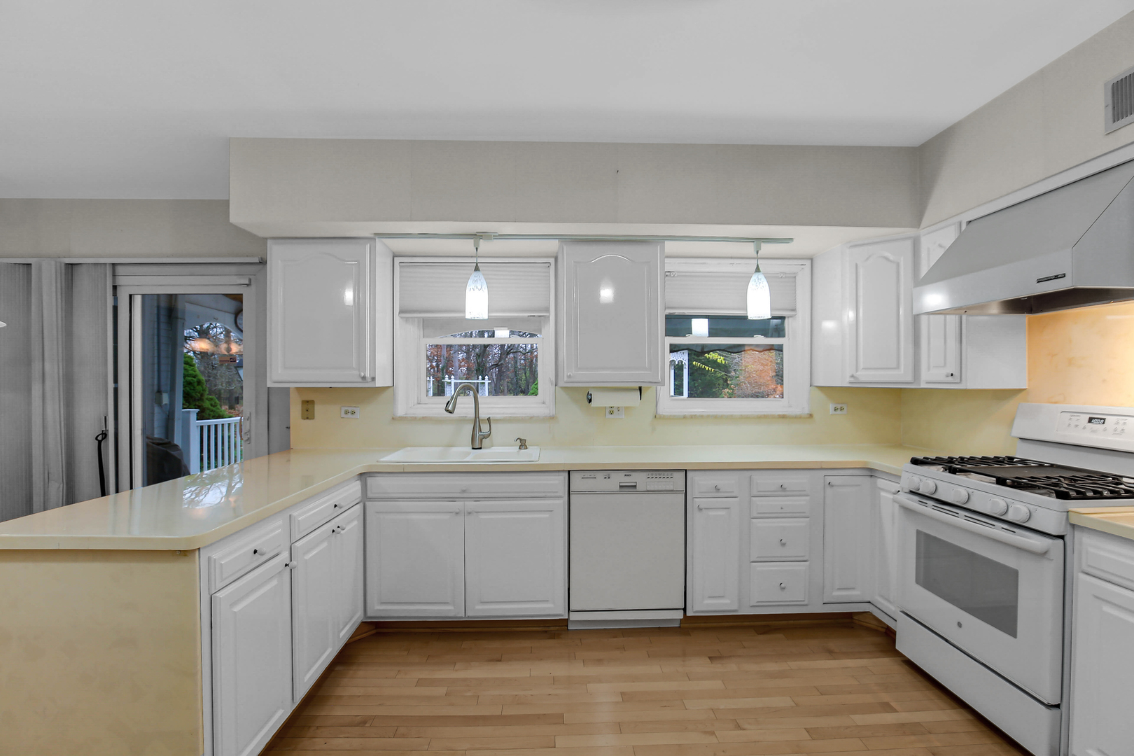 9S174 Drew Avenue Burr Ridge, IL 60527 - Photo 20 of 49 a large white kitchen with stainless steel appliances granite countertop a stove and a sink