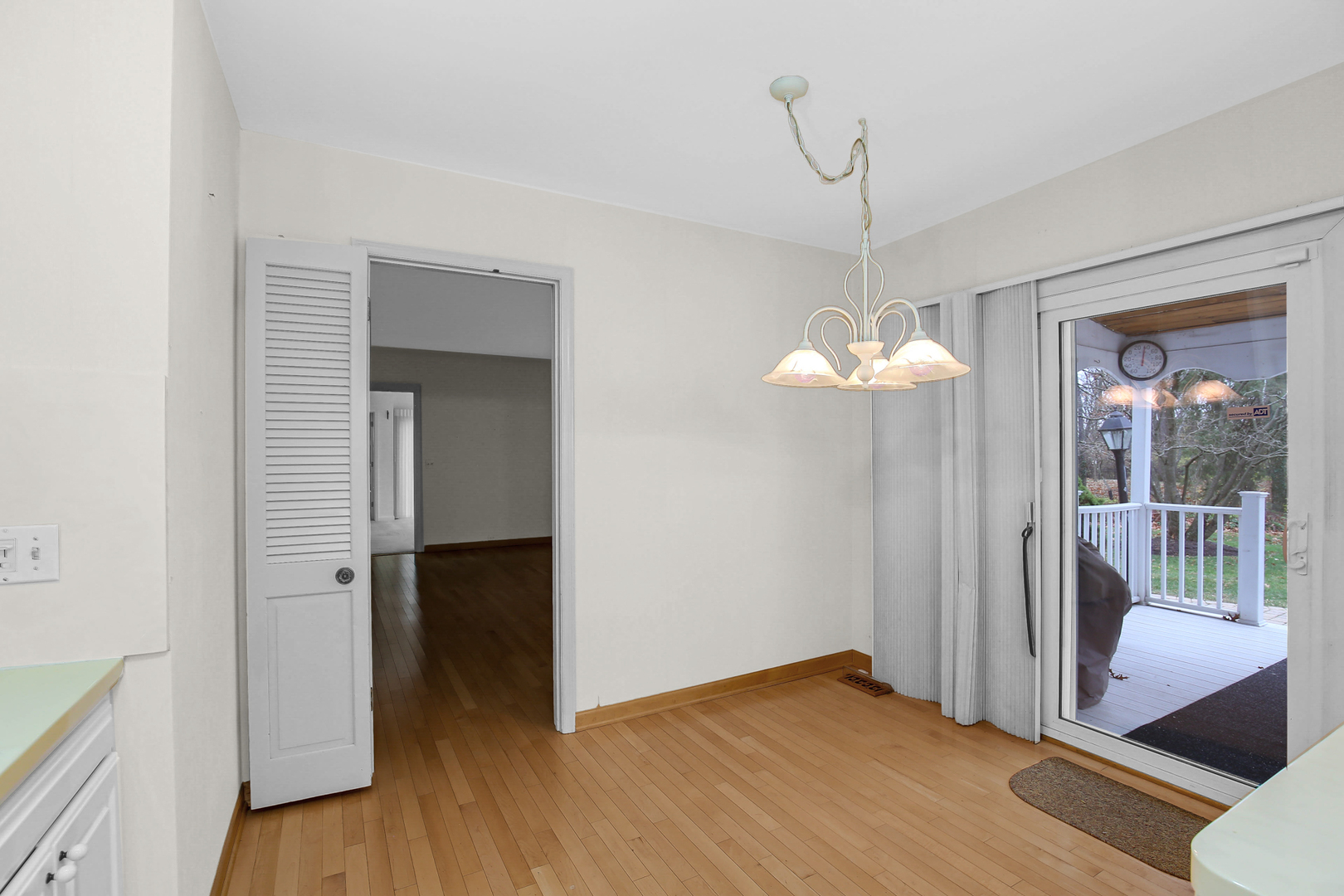 9S174 Drew Avenue Burr Ridge, IL 60527 - Photo 27 of 49 a view of an empty room with a window and wooden floor