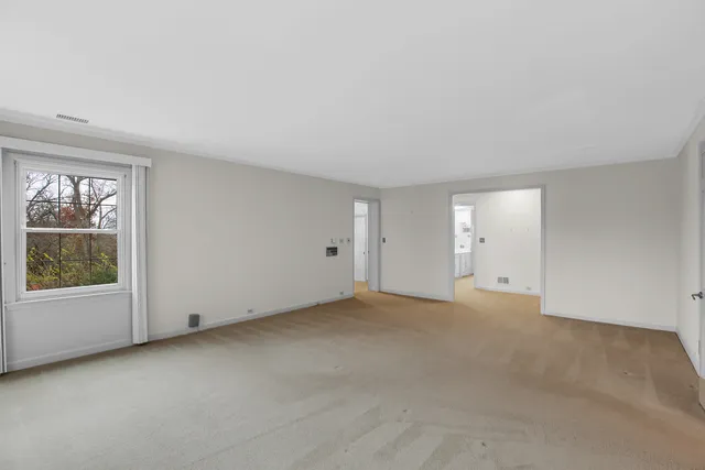 a bathroom with a toilet sink vanity and mirror