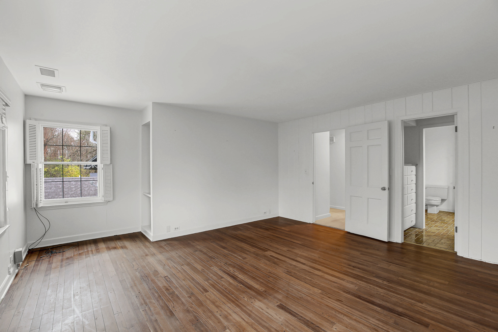 9S174 Drew Avenue Burr Ridge, IL 60527 - Photo 35 of 49 a view of empty room with wooden floor and fan