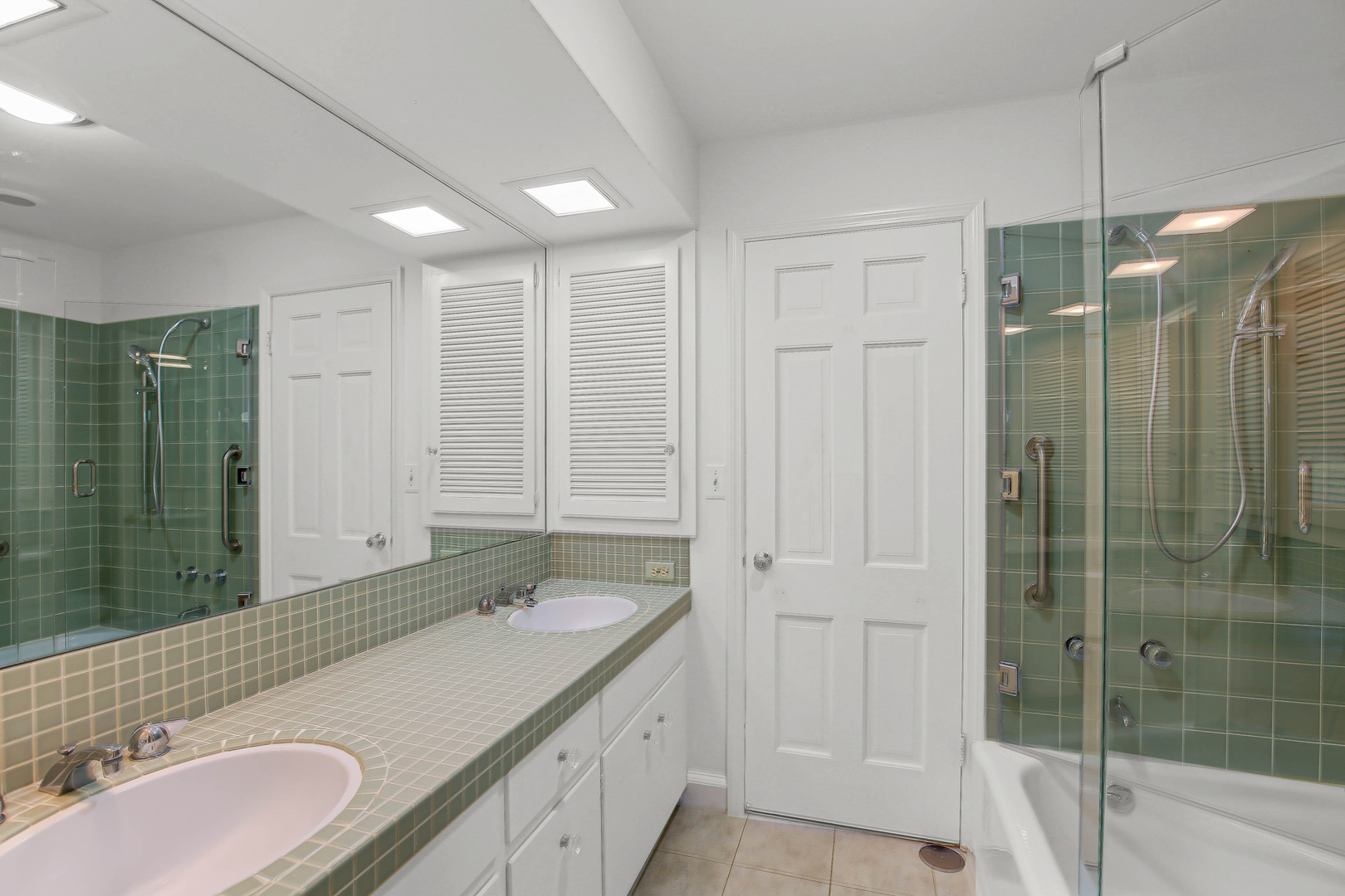 9S174 Drew Avenue Burr Ridge, IL 60527 - Photo 38 of 49 a bathroom with a double vanity sink and a mirror