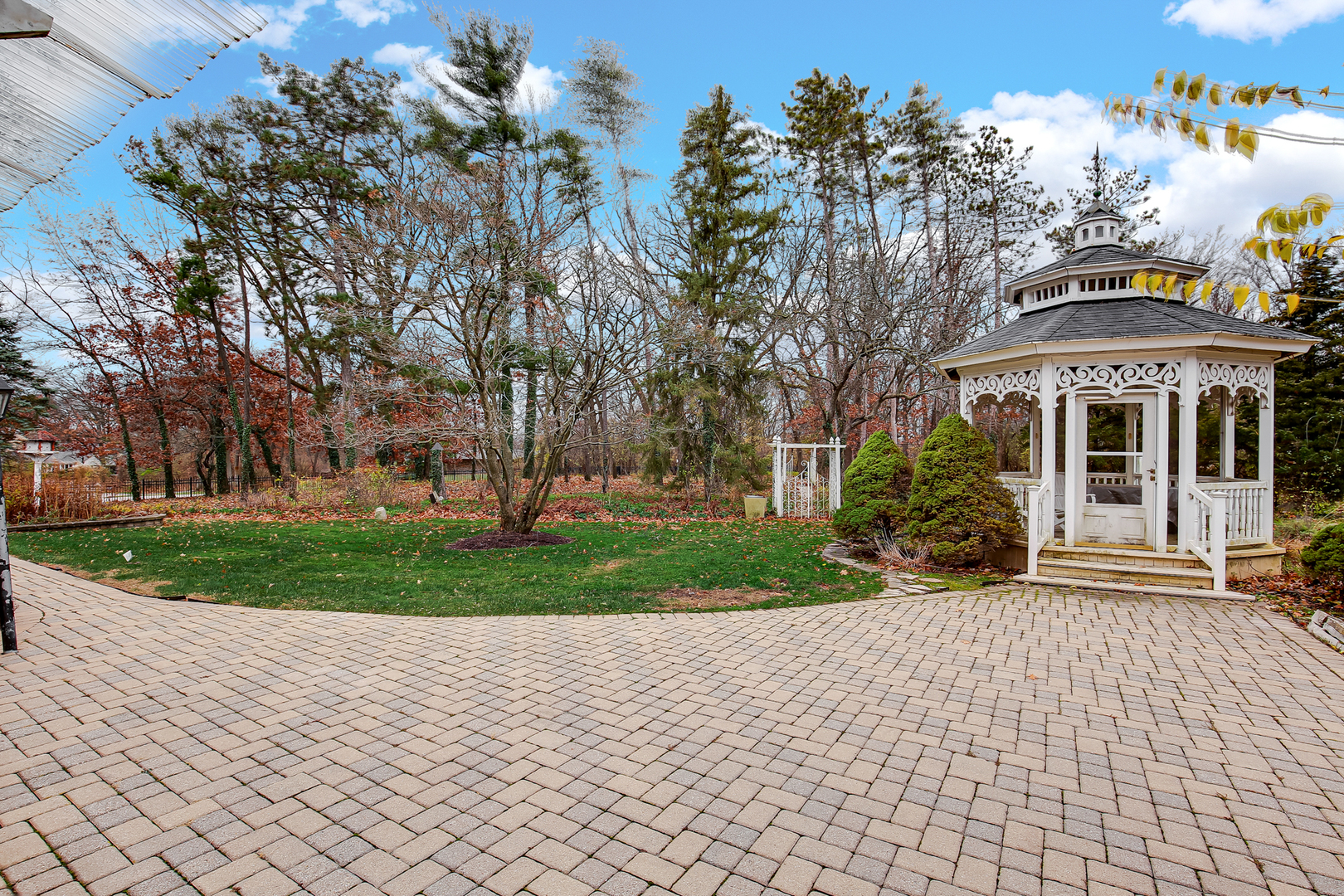 9S174 Drew Avenue Burr Ridge, IL 60527 - Photo 6 of 49 a front view of a house with a yard and trees