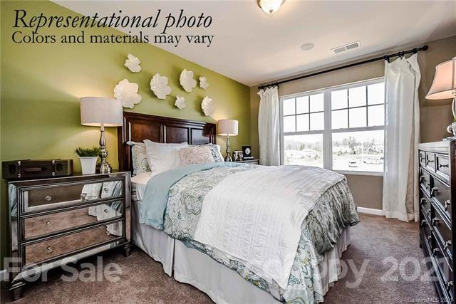1663 Corwin Bend Road Tega Cay, SC 29708 - Photo 9 of 9 a bedroom with a bed and a window
