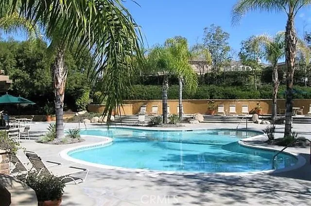 a view of a swimming pool with a patio