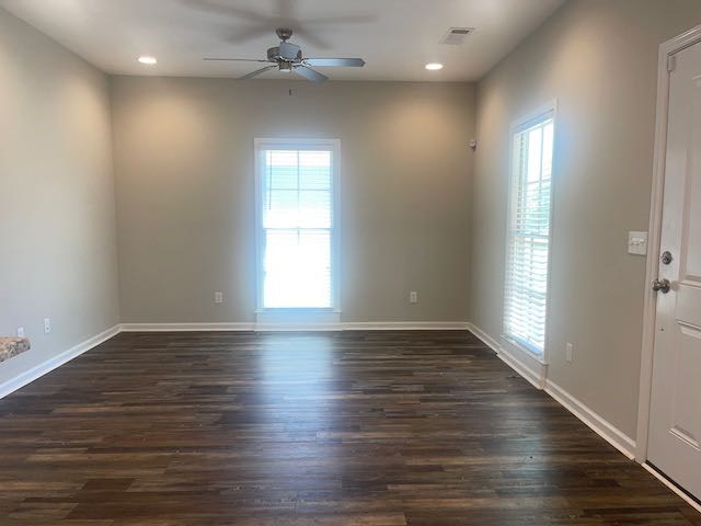 3612 4th Avenue Columbus, GA 31904 - Photo 18 of 19 an empty room with wooden floor and windows