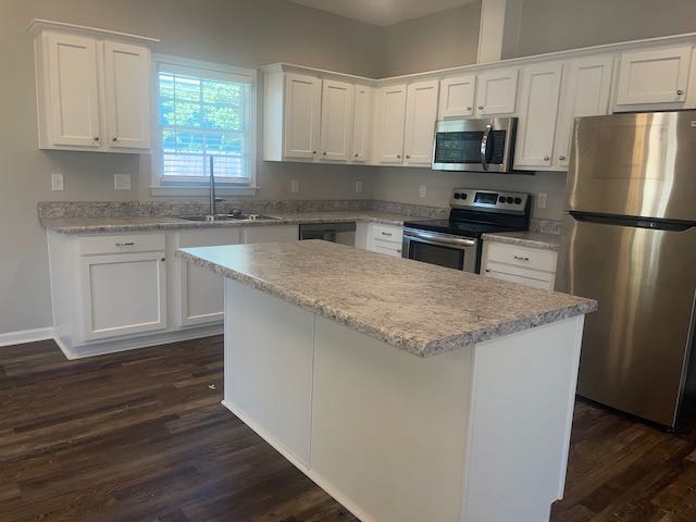 3612 4th Avenue Columbus, GA 31904 - Photo 3 of 19 a kitchen with stainless steel appliances granite countertop a sink stove and refrigerator