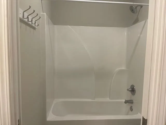 a close up of a bathtub in a bathroom