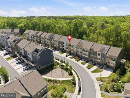 an aerial view of a house with yard