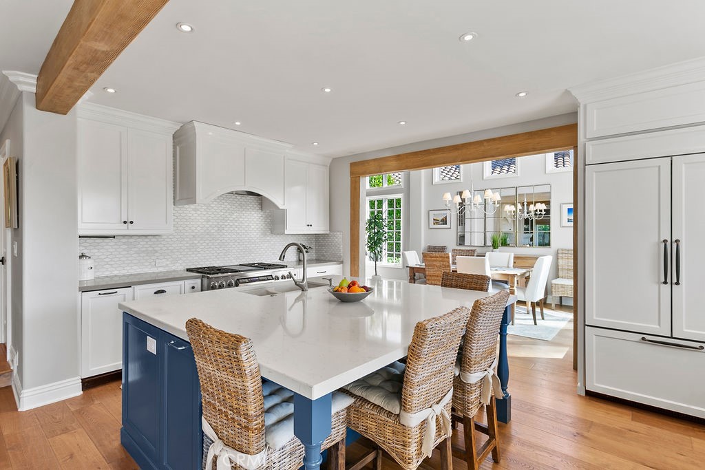 1 White Sail Laguna Niguel, CA 92677 - Photo 11 of 50 a kitchen with a stove a refrigerator a dining table and chairs with wooden floor