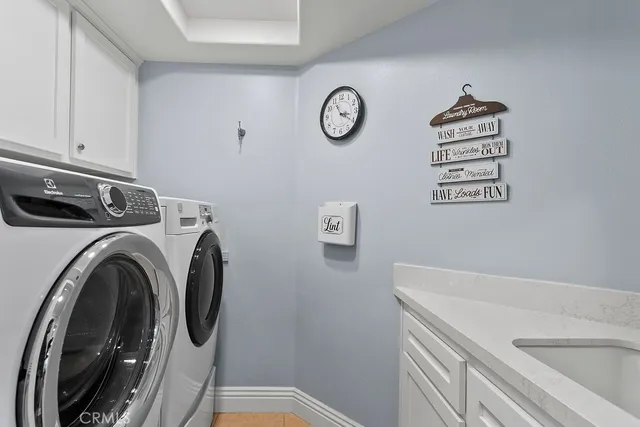 a view of storage and utility room with washer and dryer