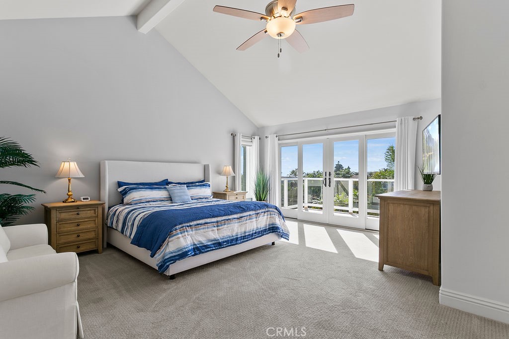 1 White Sail Laguna Niguel, CA 92677 - Photo 17 of 50 a spacious bedroom with a bed and a chandelier