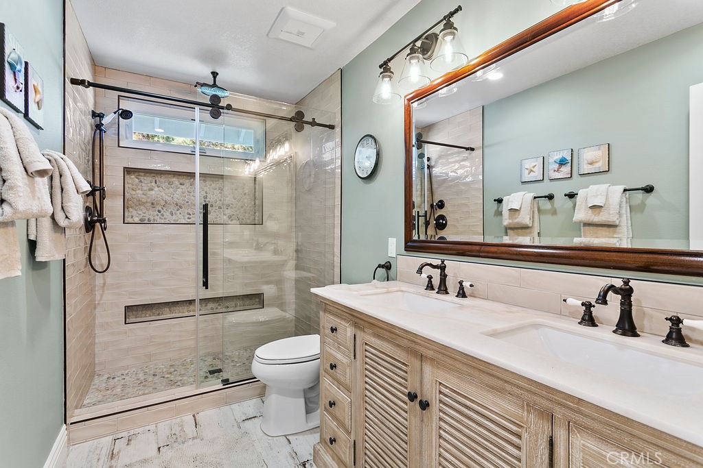 1 White Sail Laguna Niguel, CA 92677 - Photo 22 of 50 a bathroom with a sink toilet and shower