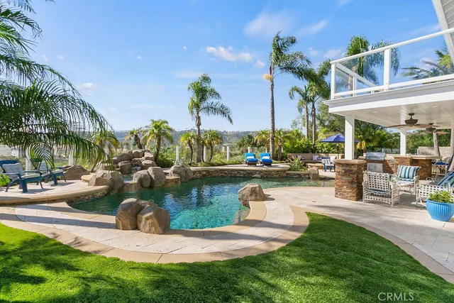 a view of a lake with couches and chairs
