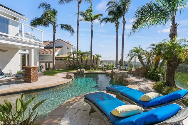 a view of swimming pool with outdoor seating