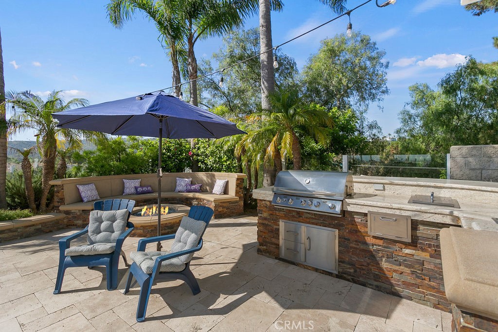 1 White Sail Laguna Niguel, CA 92677 - Photo 33 of 50 a patio with a patio table and chairs