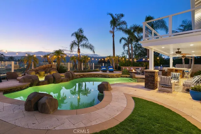a view of a swimming pool with a patio
