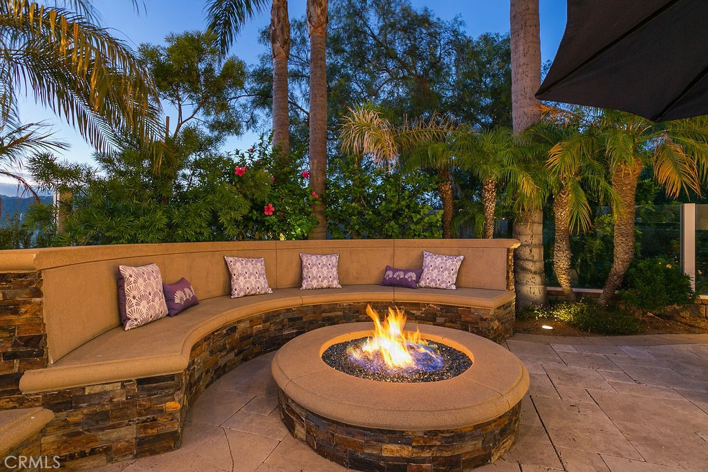1 White Sail Laguna Niguel, CA 92677 - Photo 41 of 50 a outdoor sitting area with a couch and palm trees