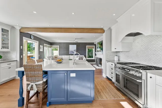 a kitchen with stainless steel appliances granite countertop a stove and a refrigerator