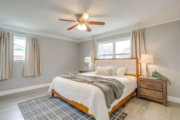 a bedroom with a bed and a window