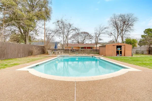 a view of outdoor space yard swimming pool and trees