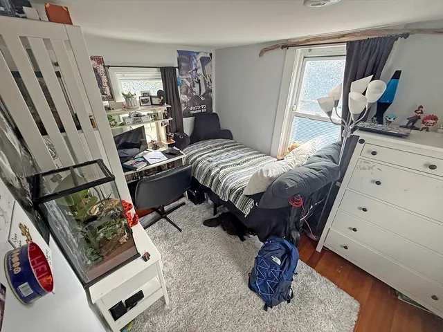 a bed room with a bed and a window