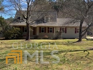 150 Fowler Mill Road Bogart, GA 30622 - Photo 1 of 1 a front view of a house with a garden