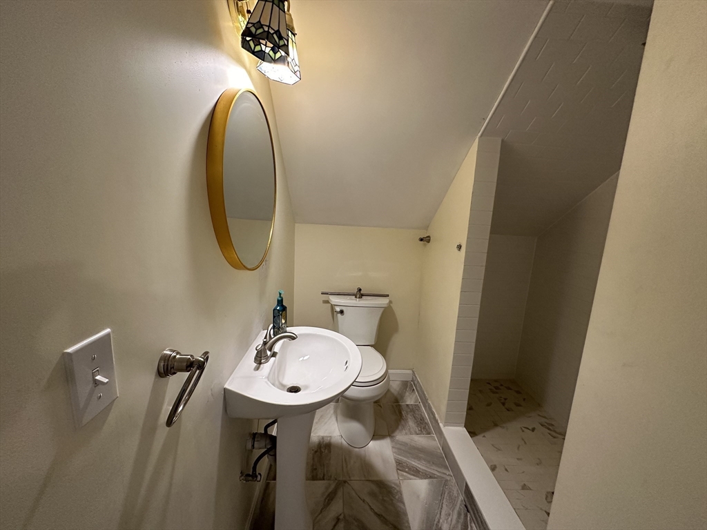 8 Pike Street Hopkinton, MA 01748 - Photo 32 of 34 a bathroom with a sink and a mirror