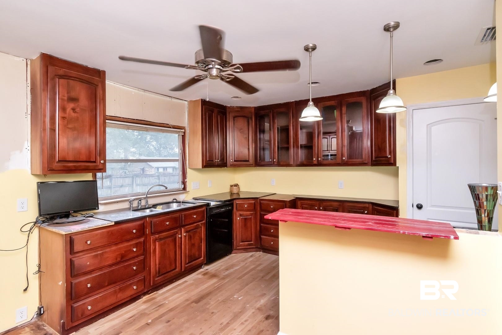 2762 Hillcrest Road Mobile, AL 36695 - Photo 11 of 25 Kitchen with light hardwood / wood-style floors, dishwasher, hanging light fixtures, sink, and ceiling fan