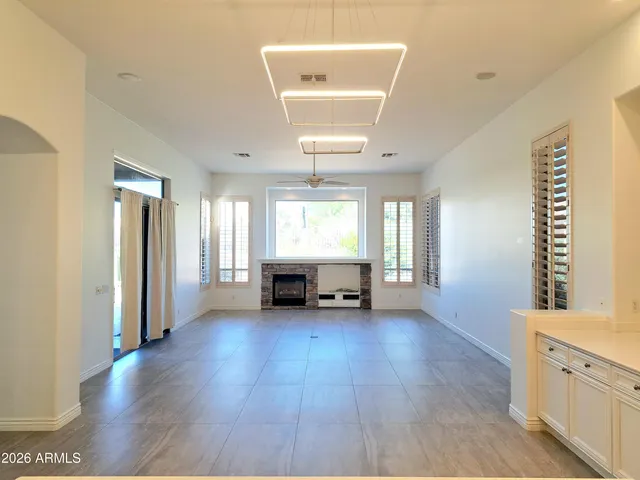 a large kitchen with stainless steel appliances kitchen island granite countertop a large counter top and stainless steel appliances