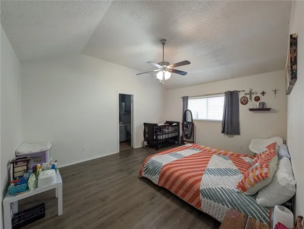 a bedroom with bed and window