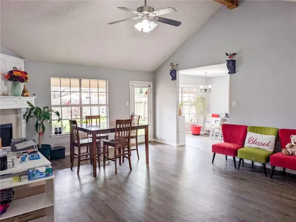 a view of a livingroom with furniture window and wooden floor