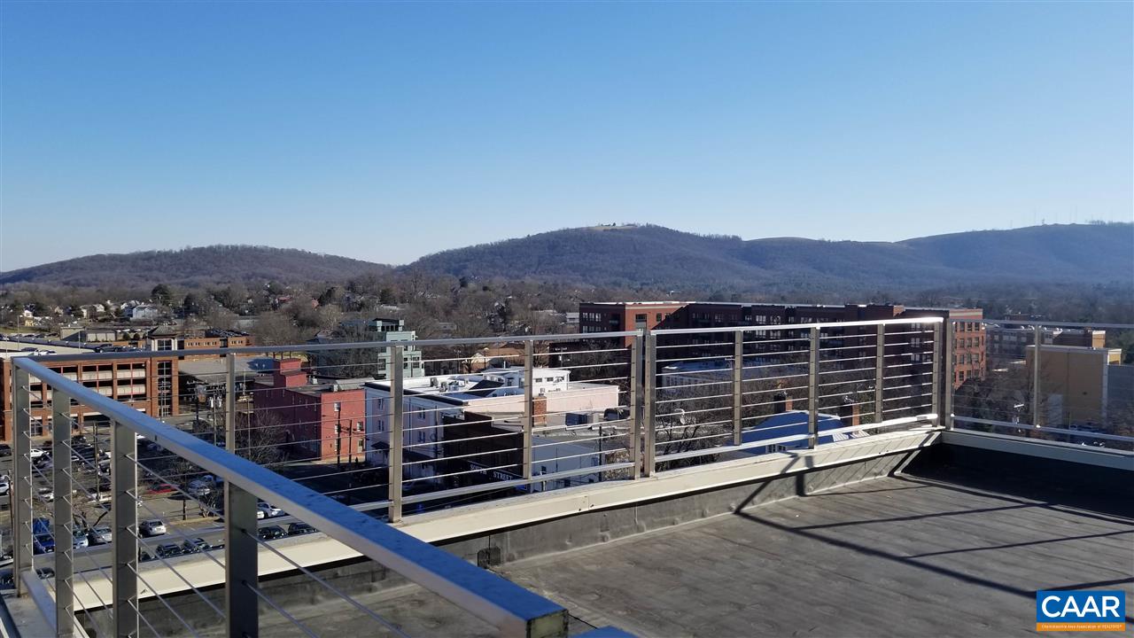 218 West Water Street, Unit 801 Charlottesville, VA 22902 - Photo 1 of 32 a view of a terrace with a bench