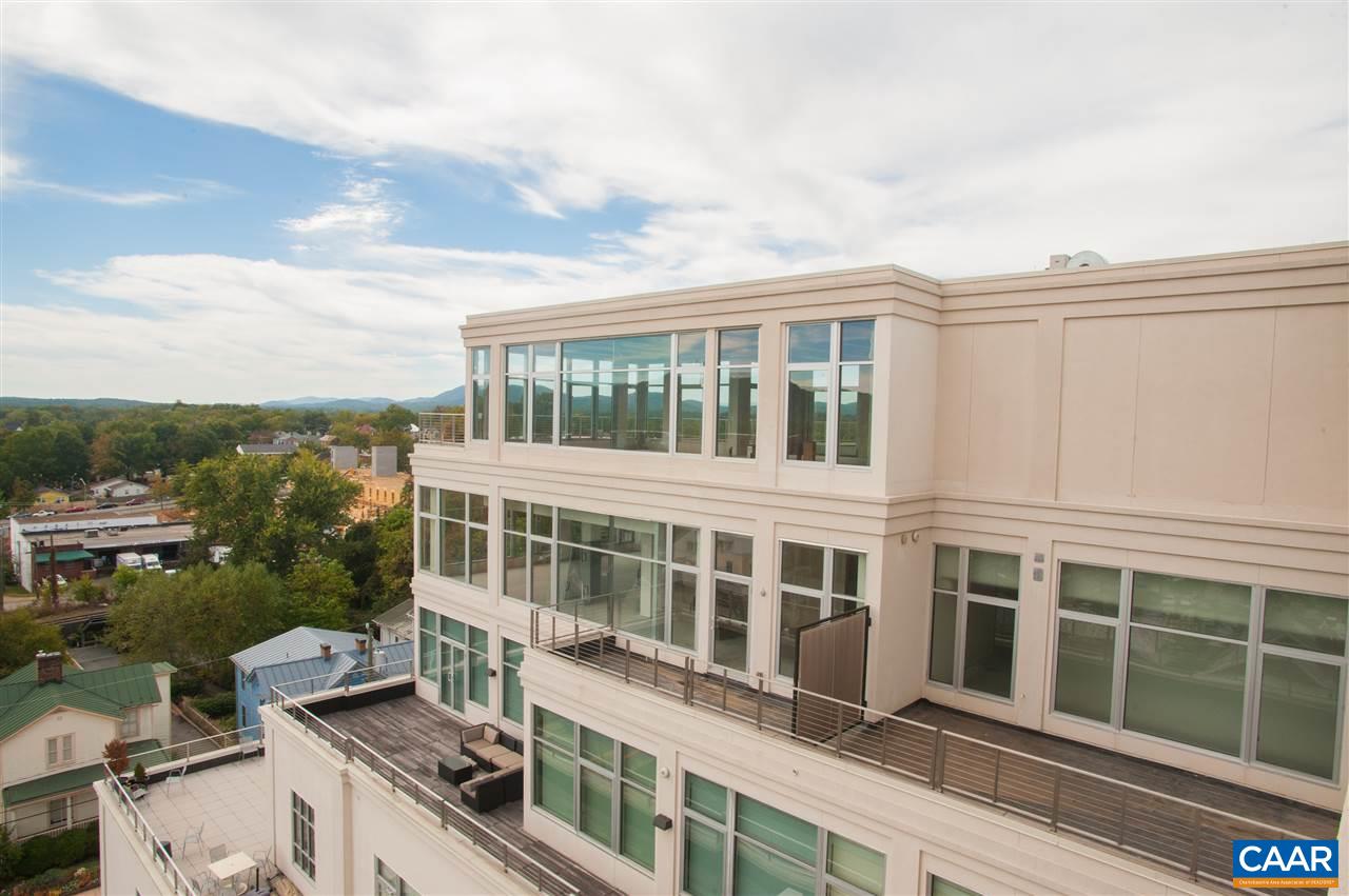 218 West Water Street, Unit 801 Charlottesville, VA 22902 - Photo 20 of 32 a view of a large building with a lot of windows