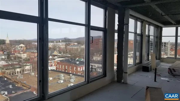 a view of a room with a large window