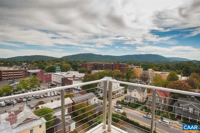 a view of a city from a balcony with city