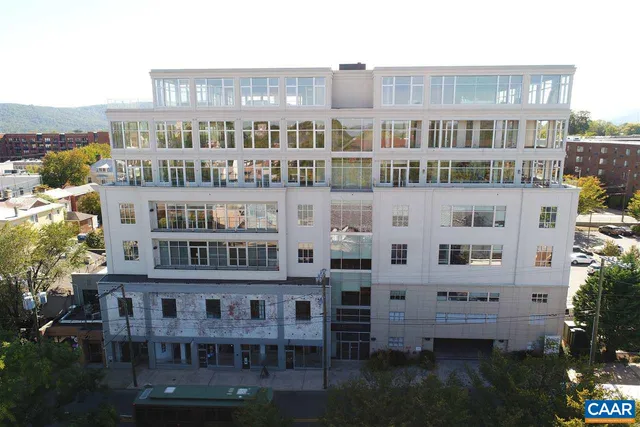 a view of a building with a garden and plants
