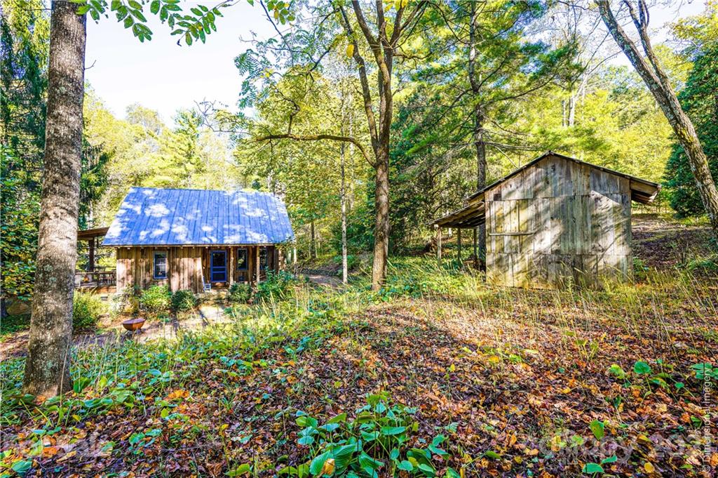 150 Staton Ridge Road Saluda, NC 28773 - Photo 29 of 44 a view of a house with a yard