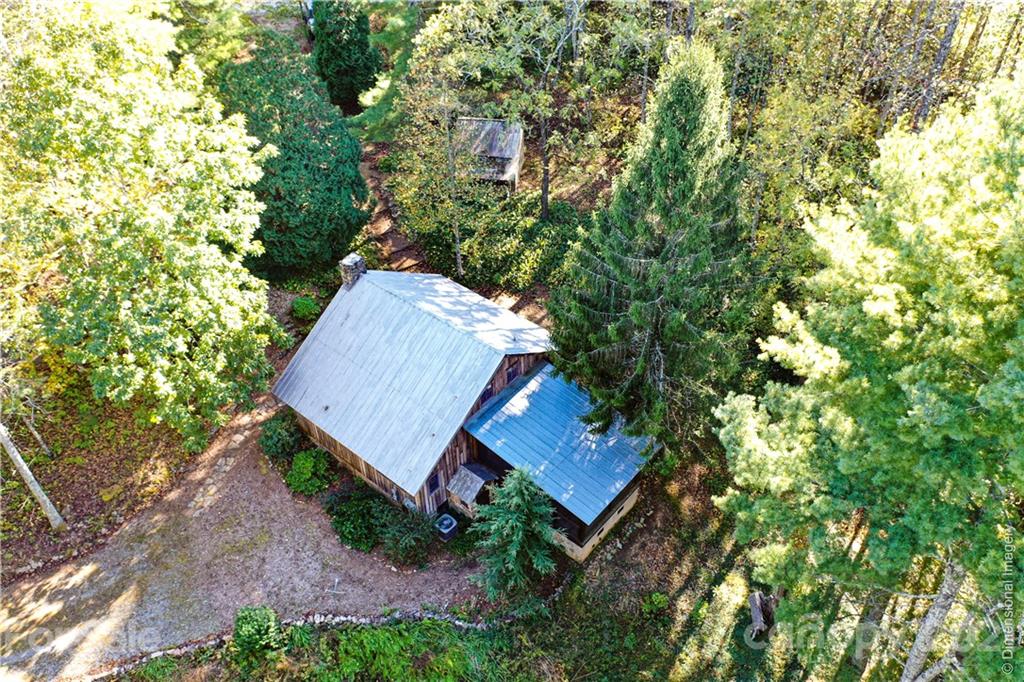 150 Staton Ridge Road Saluda, NC 28773 - Photo 34 of 44 an aerial view of a house with yard and outdoor seating