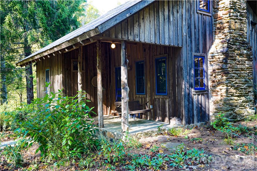 150 Staton Ridge Road Saluda, NC 28773 - Photo 40 of 44 a view of small house with yard and sitting area